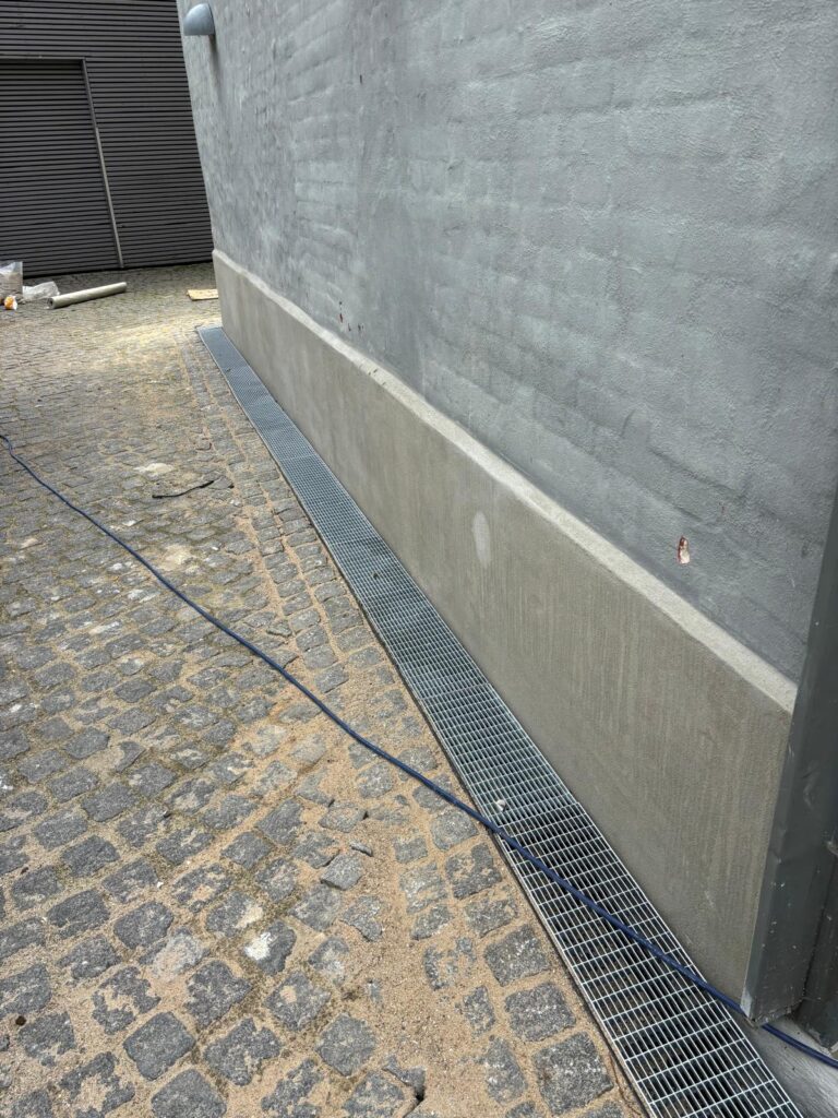 Renovering af pudset sokkel på fredet ejendom